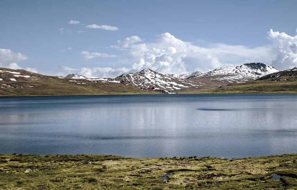a large body of water surrounded by mountains